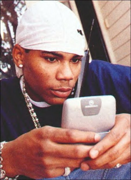 Nelly on his phone and 2-way
